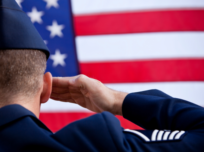 soldier saluting the US flag